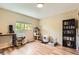 Bright bedroom with hardwood floors, natural light, and ample space for work and cat furniture at 16602 E Gunnison Pl, Aurora, CO 80017