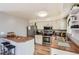 Functional kitchen featuring modern appliances, wooden countertops, ample cabinet space, and a breakfast bar at 16602 E Gunnison Pl, Aurora, CO 80017