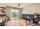 Bright kitchen features wood floors and access to the outdoor patio at 16602 E Gunnison Pl, Aurora, CO 80017
