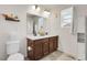 Bathroom featuring double vanity, white countertop, decorative accents, and neutral flooring at 4358 S Nepal Ct, Centennial, CO 80015