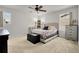 Bright bedroom features neutral walls, large windows, and a ceiling fan at 4358 S Nepal Ct, Centennial, CO 80015
