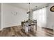 Sunlit dining room with elegant chandelier and stylish decor at 4358 S Nepal Ct, Centennial, CO 80015