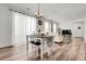 Bright dining room with seating, and hardwood floors, and access to living space at 4358 S Nepal Ct, Centennial, CO 80015