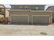 Attached garages with side-by-side entry feature two doors and neutral-colored siding at 4358 S Nepal Ct, Centennial, CO 80015