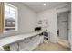Bright home office with a long desk and neutral design at 4358 S Nepal Ct, Centennial, CO 80015