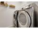 Modern laundry room with front-loading washer and dryer at 4358 S Nepal Ct, Centennial, CO 80015