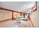 Basement living area features recessed lighting, comfortable seating, and exposed wooden beams, creating a cozy retreat at 1464 S Grant St, Denver, CO 80210