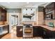 Beautiful kitchen with dark cabinets, stainless steel oven, and granite countertops at 1464 S Grant St, Denver, CO 80210