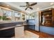 Well-lit home office with custom built-ins, desk, and large windows at 1464 S Grant St, Denver, CO 80210