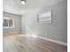 Neutral bedroom featuring a large window, light-colored walls, and modern flooring at 1934 Macon St, Aurora, CO 80010