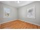 This bedroom has hardwood floors and two windows, providing ample natural light at 1934 Macon St, Aurora, CO 80010