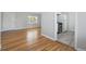 A seamless transition between hardwood and tile floorings defining the kitchen area at 1934 Macon St, Aurora, CO 80010