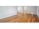 Bright living room with light gray walls and beautiful hardwood floors throughout at 1934 Macon St, Aurora, CO 80010