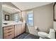 Modern powder room with floating vanity and patterned floor at 544 Monroe St, Denver, CO 80206