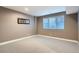 Bright and airy bedroom with neutral walls and carpeting at 544 Monroe St, Denver, CO 80206