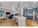 Spacious kitchen features a large kitchen island with room for seating and stainless steel appliances at 30 Stewart Way, Erie, CO 80516