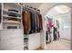 Walk-in closet with custom shelving and ample storage space for clothing and accessories at 1250 Oneida St, Denver, CO 80220