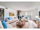 Inviting living room features a stone fireplace and sliding doors to the outside at 922 S Walden Street St # 103, Aurora, CO 80017