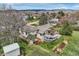 Aerial view of the property with a deck, patio, hot tub, and landscaping, showcasing the outdoor space at 5855 Rustic Knolls Dr, Boulder, CO 80301