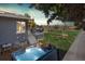 Backyard with a hot tub, deck, and a lush lawn, perfect for outdoor relaxation and entertaining at 5855 Rustic Knolls Dr, Boulder, CO 80301