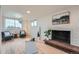 Finished basement featuring a brick fireplace and natural light at 5855 Rustic Knolls Dr, Boulder, CO 80301