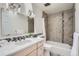 Bathroom with a tiled shower, modern fixtures, and a spacious vanity with plenty of storage at 5855 Rustic Knolls Dr, Boulder, CO 80301