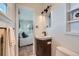 Bathroom featuring modern lighting and fixtures, with the bedroom visible through the doorway at 5855 Rustic Knolls Dr, Boulder, CO 80301