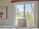 Window view from the bedroom overlooking a peaceful landscape, bringing the beauty of nature indoors at 5855 Rustic Knolls Dr, Boulder, CO 80301