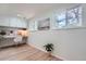 Bright home office featuring built-in desk, white cabinetry, and large window providing ample natural light at 5855 Rustic Knolls Dr, Boulder, CO 80301