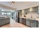 Modern kitchen with gray cabinets, stainless steel appliances, ample counter space at 5855 Rustic Knolls Dr, Boulder, CO 80301