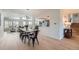 Open-concept living space featuring dining and living room with new flooring and lots of natural light at 5855 Rustic Knolls Dr, Boulder, CO 80301