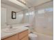 Cozy bathroom with shower-tub combo, vanity, and mirror at 3844 S Gibralter St, Aurora, CO 80013