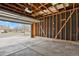 Unfinished garage with concrete floors at 3844 S Gibralter St, Aurora, CO 80013