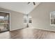 Bright living room features wood-look floors, vaulted ceilings, and ample natural light at 3844 S Gibralter St, Aurora, CO 80013