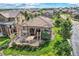 Aerial view of a house with a large backyard and patio at 10443 Skyreach Way, Highlands Ranch, CO 80126