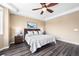 Spacious bedroom with ceiling fan and wood-look floors at 10443 Skyreach Way, Highlands Ranch, CO 80126