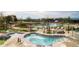 Community pool and hot tubs with ample seating at 10443 Skyreach Way, Highlands Ranch, CO 80126