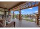 Large deck with pergola, offering scenic neighborhood views at 10443 Skyreach Way, Highlands Ranch, CO 80126