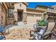 Brick patio area with seating, located at the front entrance of the house at 10443 Skyreach Way, Highlands Ranch, CO 80126