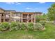 House exterior showcasing a beautiful backyard with blooming bushes at 10443 Skyreach Way, Highlands Ranch, CO 80126