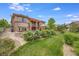 House exterior showcasing a large backyard and landscaping at 10443 Skyreach Way, Highlands Ranch, CO 80126