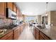 Spacious kitchen with granite countertops and stainless steel appliances at 10443 Skyreach Way, Highlands Ranch, CO 80126