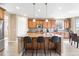 Large kitchen with island, granite countertops, and stainless steel appliances at 10443 Skyreach Way, Highlands Ranch, CO 80126