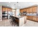 Kitchen boasts granite countertops, stainless steel appliances, and an island at 10443 Skyreach Way, Highlands Ranch, CO 80126