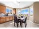 Bright kitchen nook with a table and chairs, offering a view at 10443 Skyreach Way, Highlands Ranch, CO 80126