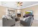 Living room with fireplace, large TV, and comfortable seating at 10443 Skyreach Way, Highlands Ranch, CO 80126