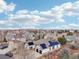 A high-angle view shows a home with solar panels in a well-developed neighborhood on a partly cloudy day at 14642 Sorrel Dr, Broomfield, CO 80023