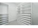 Walk-in closet features built-in shelving and drawers at 14642 Sorrel Dr, Broomfield, CO 80023