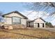 A well-maintained single-story home featuring a three-car garage and stone accents at 14642 Sorrel Dr, Broomfield, CO 80023