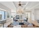 Cozy living room with a fireplace, hardwood floors, and an open layout at 14642 Sorrel Dr, Broomfield, CO 80023